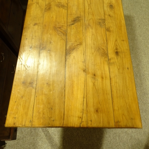 313 - A 19th century French fruitwood farmhouse dining table with plank top, single side frieze drawer and... 