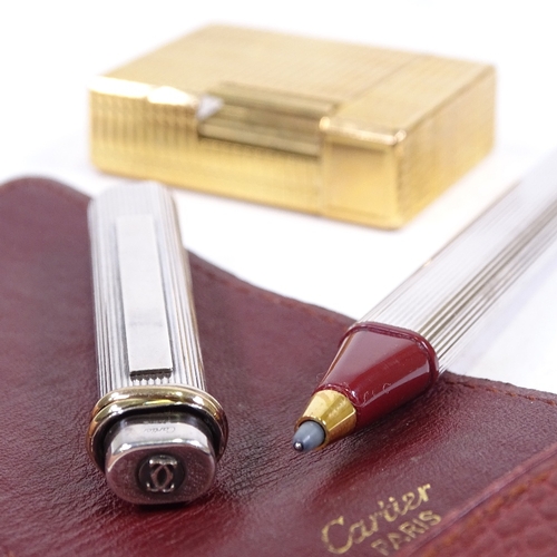 89 - A Cartier plated rollerball pen in original leather wallet, and a Dupont gold plated pocket lighter ... 