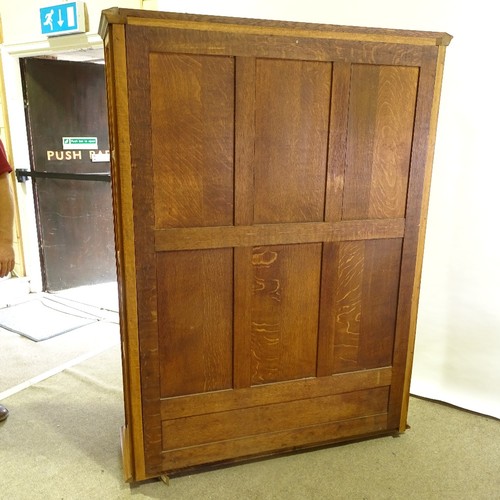 324 - A French cherrywood 2-door bookcase, circa 1920s, arch glazed panelled doors with floral carved gild... 