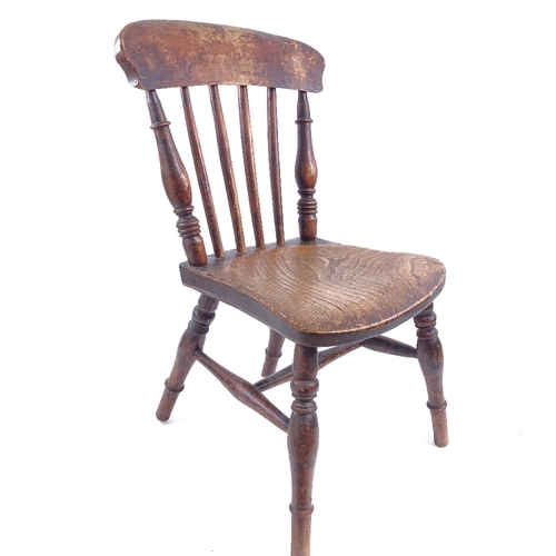 85 - An Antique elm seated stick-back child's chair, on turned legs, seat height 29cm