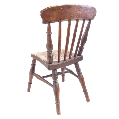 85 - An Antique elm seated stick-back child's chair, on turned legs, seat height 29cm