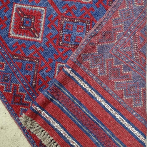 1851 - A Meshwani red ground runner, 256cm x 64cm