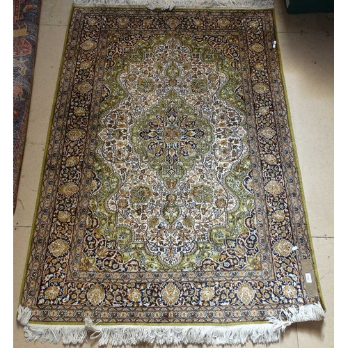 1852 - A silk and wool Persian design rug, 175cm x 124cm