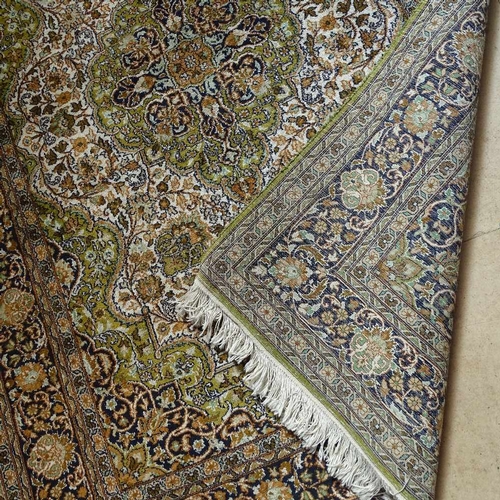 1852 - A silk and wool Persian design rug, 175cm x 124cm