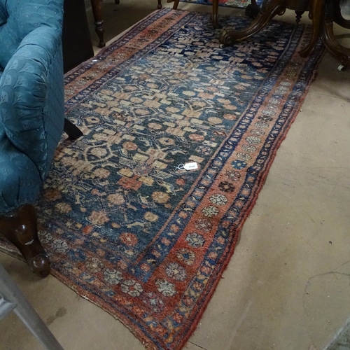 1860 - An Antique red ground Beluchi rug, 210cm x 115cm