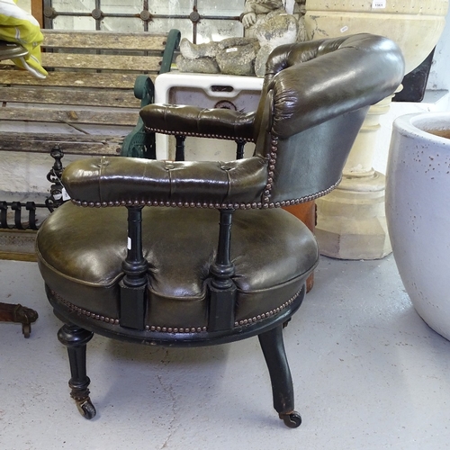 1848 - A Victorian ebonised and studded leather upholstered bow-arm desk chair