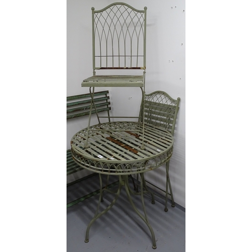 1807 - A painted metal circular garden table, and a pair of matching folding chairs