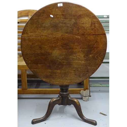 1823 - A Georgian oak tilt-top table, on tripod base, W76cm