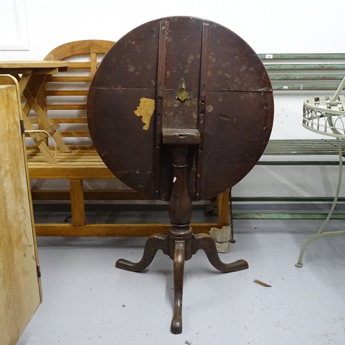 1823 - A Georgian oak tilt-top table, on tripod base, W76cm