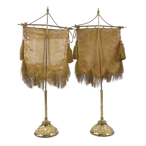 397 - A pair of 19th century Berlin beadwork face screens, mounted on original gilt-brass stands on relief... 