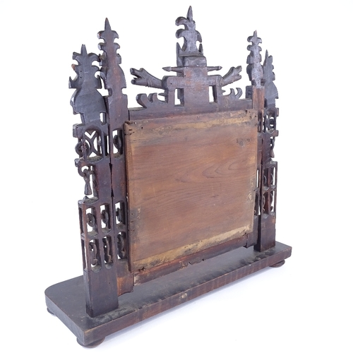 10 - A rare 18th century Welsh Folk Art carved and pierced wood-framed toilet mirror, with dragon decorat... 