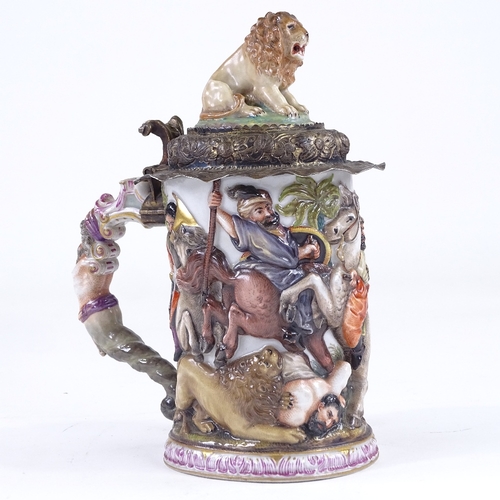 103 - A Capodimonte porcelain tankard, relief moulded Classical battle scene decoration surmounted by a li... 