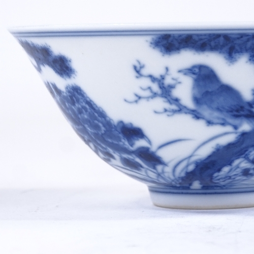 131 - A Chinese blue and white porcelain bowl, with hand painted bats and blossom trees, 6 character mark,... 