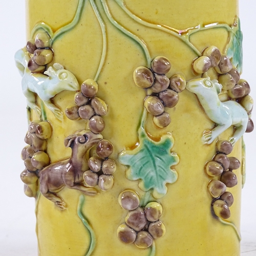 138 - A Chinese yellow glaze porcelain cylinder vase, high relief decorated squirrels and acorns, height 1... 