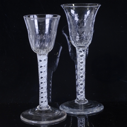 147 - 2 18th century cordial glasses with milk twist stems, height 16cm and 15cm