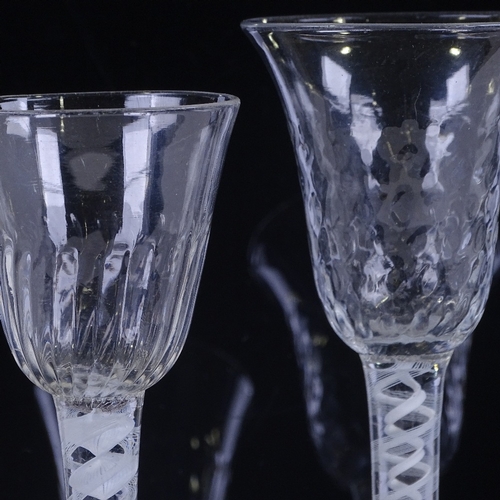 147 - 2 18th century cordial glasses with milk twist stems, height 16cm and 15cm