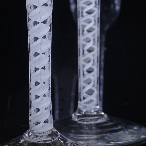 147 - 2 18th century cordial glasses with milk twist stems, height 16cm and 15cm