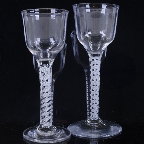 148 - 2 18th century cordial glasses with milk twist stems, height 15cm (2)