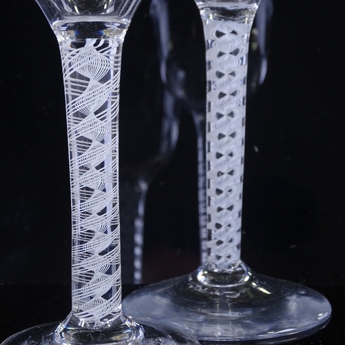 148 - 2 18th century cordial glasses with milk twist stems, height 15cm (2)