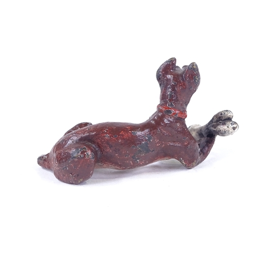 154 - An Austrian cold painted bronze dog with a bone, length 6.5cm