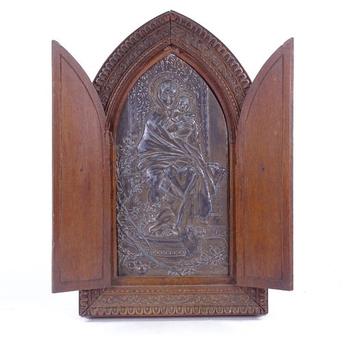 162 - A relief cast patinated spelter icon in original carved wood lancet-topped cabinet, height 27cm