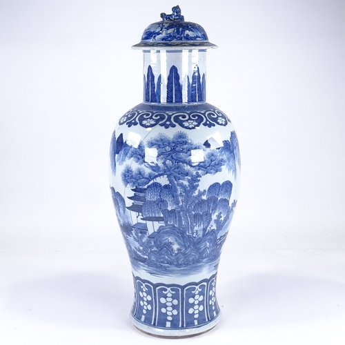 168 - A Chinese blue and white porcelain vase and cover, hand painted landscape decoration, overall height... 