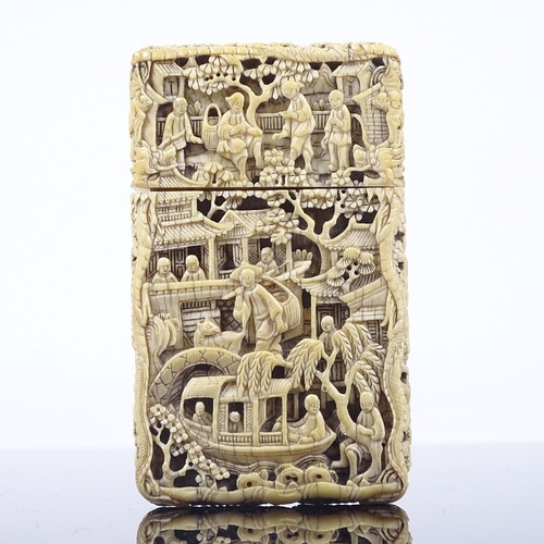 183 - A 19th century Chinese relief carved ivory card case, heavily carved all over with river and garden ... 