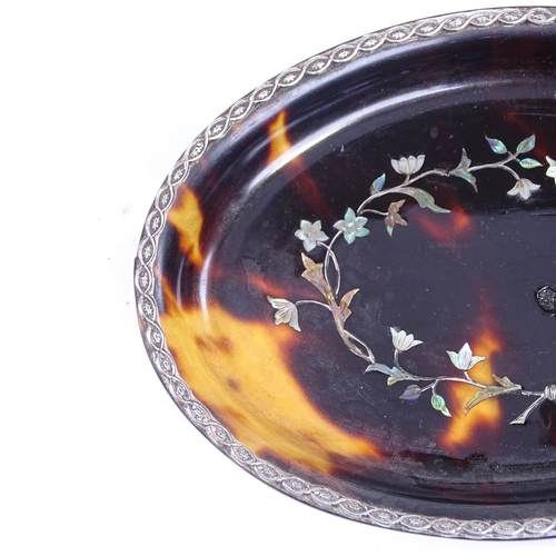 189 - A 19th century oval tortoiseshell dish, with inlaid mother-of-pearl and silver floral marquetry, 12c... 