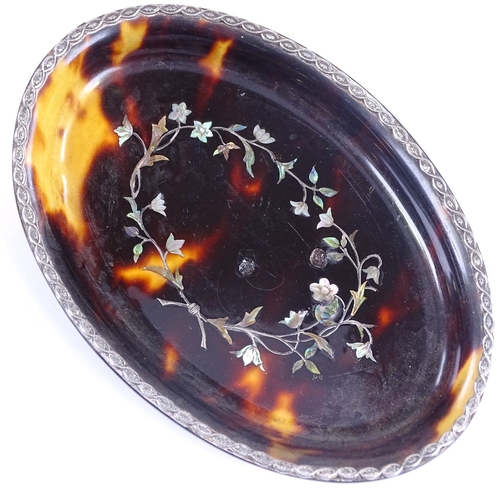 189 - A 19th century oval tortoiseshell dish, with inlaid mother-of-pearl and silver floral marquetry, 12c... 