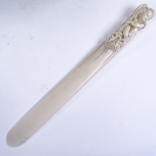 199 - A 19th century ivory page turner, with finely carved cherub and floral decorated handle, length 30cm