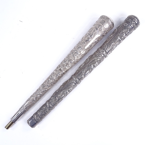 200 - 2 19th century Burmese unmarked silver parasol handles, length 23cm (2)