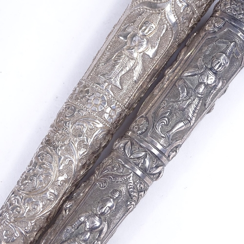 200 - 2 19th century Burmese unmarked silver parasol handles, length 23cm (2)