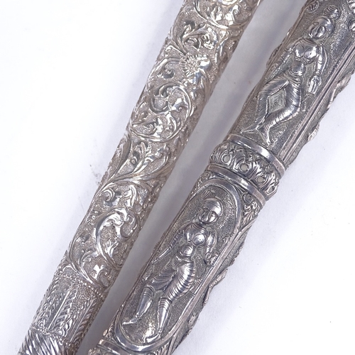 200 - 2 19th century Burmese unmarked silver parasol handles, length 23cm (2)