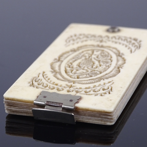 205 - A 19th century ivory aide memoire, with carved and pierced covers, and nickel plate mounts, 8cm x 4c... 