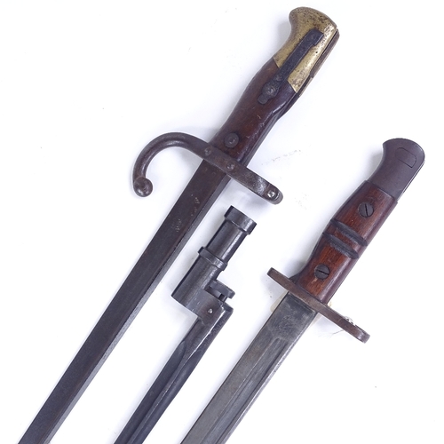 207 - A First War Period sword bayonet with leather scabbard, and 2 other early 20th century bayonets (3)