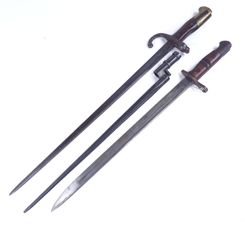 207 - A First War Period sword bayonet with leather scabbard, and 2 other early 20th century bayonets (3)