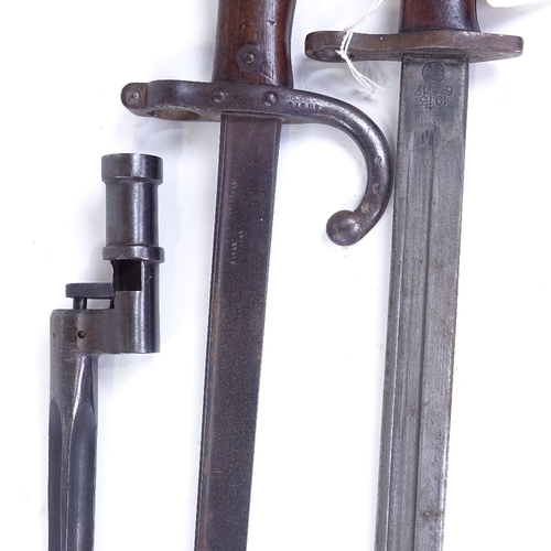 207 - A First War Period sword bayonet with leather scabbard, and 2 other early 20th century bayonets (3)