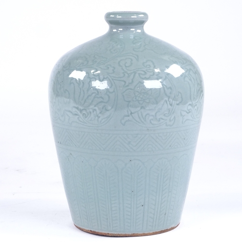 212 - A Chinese celadon glaze bottle vase with incised decoration, height 22cm