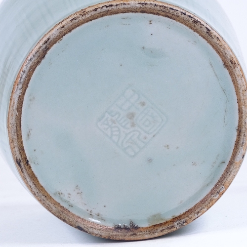 212 - A Chinese celadon glaze bottle vase with incised decoration, height 22cm