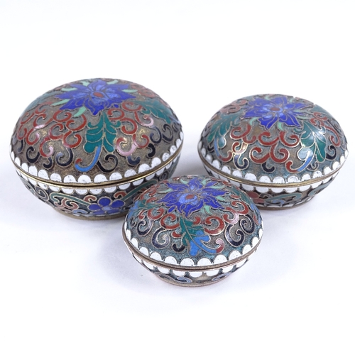 216 - A set of 3 graduated Chinese cloisonne enamel circular boxes, largest 6cm across