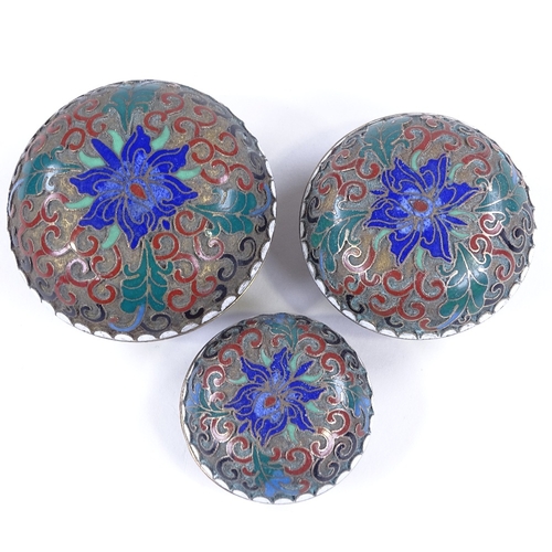 216 - A set of 3 graduated Chinese cloisonne enamel circular boxes, largest 6cm across