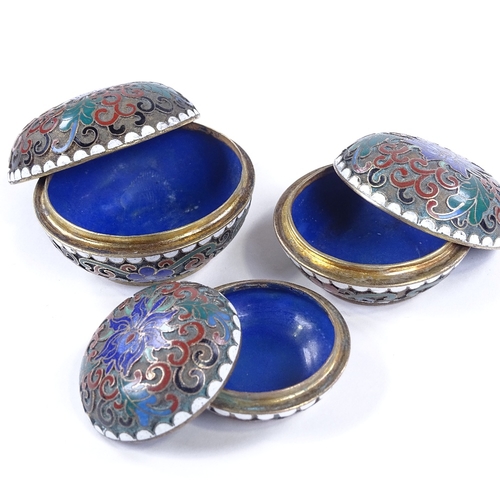 216 - A set of 3 graduated Chinese cloisonne enamel circular boxes, largest 6cm across