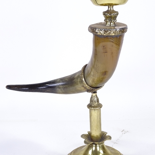 221 - A brass and buffalo horn oil lamp, with opaque glass shade, height to top of shade 75cm