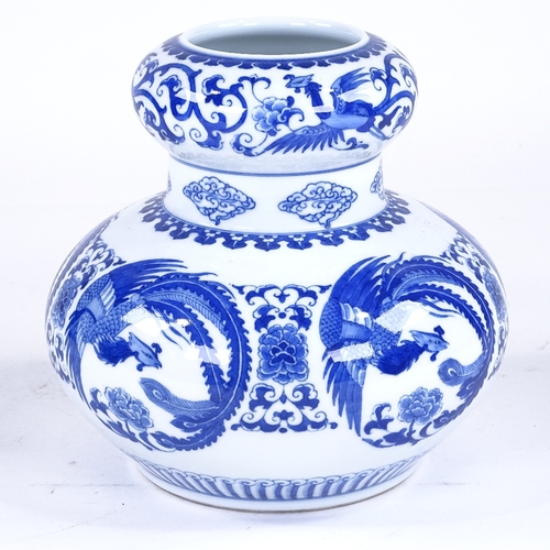 234 - A Chinese blue and white porcelain vase, with phoenix design, height 21cm