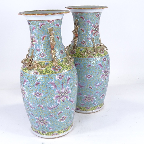 256 - A pair of Chinese porcelain vases, with painted enamel decoration and gilded dragon necks, height 47... 