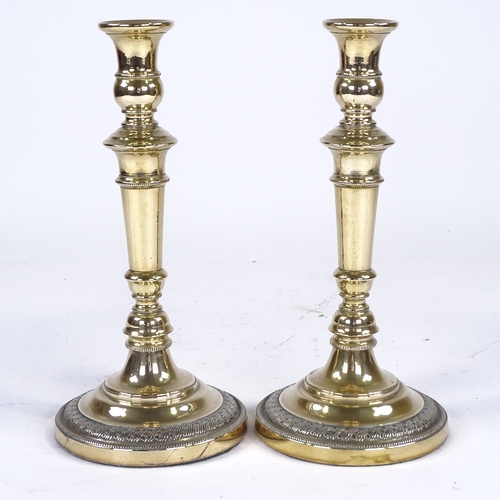 258 - A pair of 19th century Continental polished brass candlesticks, height 26cm