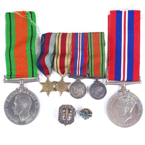 265 - A group of 4 Second War miniature medals, a 39-45 Defence medal, and a 1939-45 medal, and 2 Scouting... 