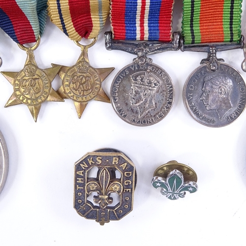 265 - A group of 4 Second War miniature medals, a 39-45 Defence medal, and a 1939-45 medal, and 2 Scouting... 