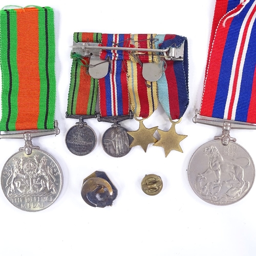 265 - A group of 4 Second War miniature medals, a 39-45 Defence medal, and a 1939-45 medal, and 2 Scouting... 