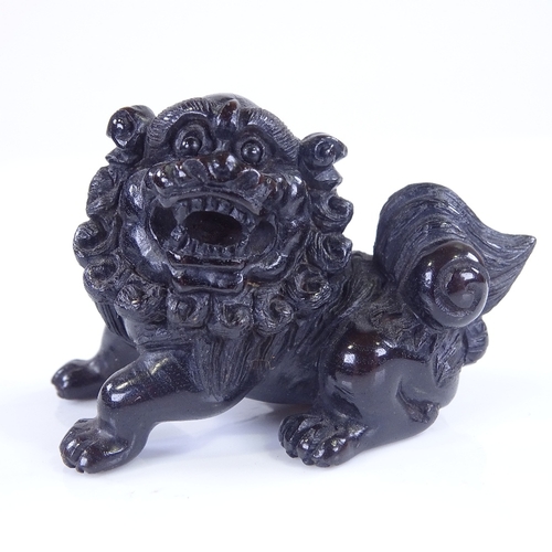 268 - A Japanese carved and stained wood Dog of Fo design netsuke, signed, length 6cm